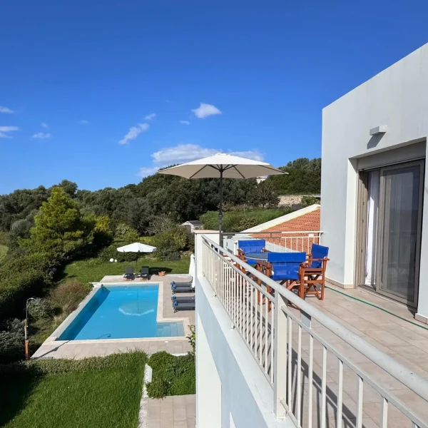 Image depicting the view from the upper terrace over the pool and countryside